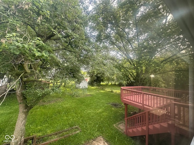 10316 Woodhaven Cir, Indianapolis, IN 46229 - view of grassy yard with a wooden deck