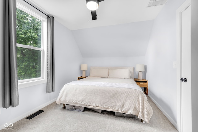 3035 Guilford Ave, Indianapolis, IN 46205 - bedroom featuring multiple windows, vaulted ceiling, carpet flooring, and ceiling fan