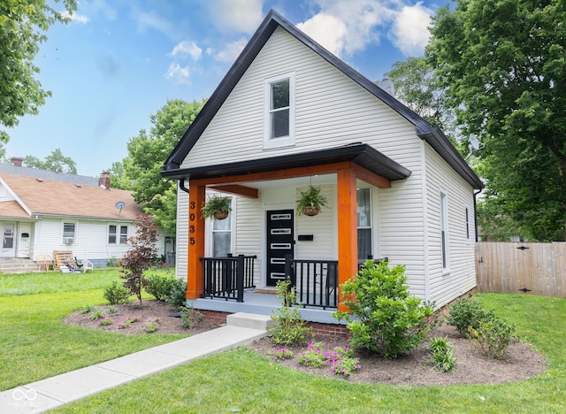 3035 Guilford Ave, Indianapolis, IN 46205 - shotgun-style home featuring covered porch