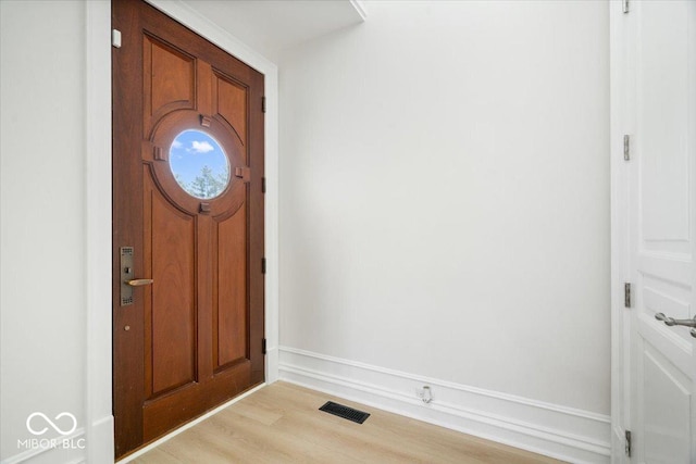 12208 Island Dr, Indianapolis, IN 46256 - entrance foyer with light wood-style flooring and baseboards
