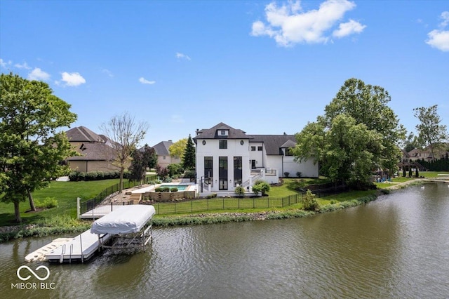 12208 Island Dr, Indianapolis, IN 46256 - dock area featuring a water view, a fenced backyard, and boat lift