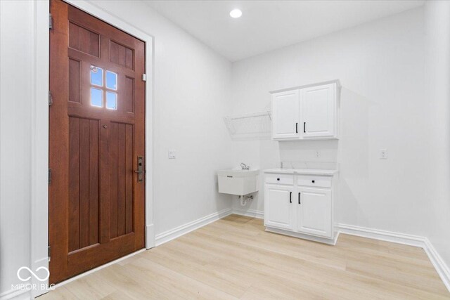 12208 Island Dr, Indianapolis, IN 46256 - foyer entrance featuring light wood-style floors and recessed lighting