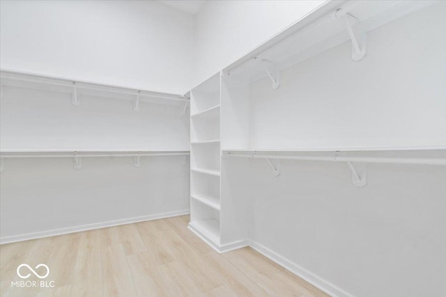12208 Island Dr, Indianapolis, IN 46256 - walk in closet featuring wood finished floors