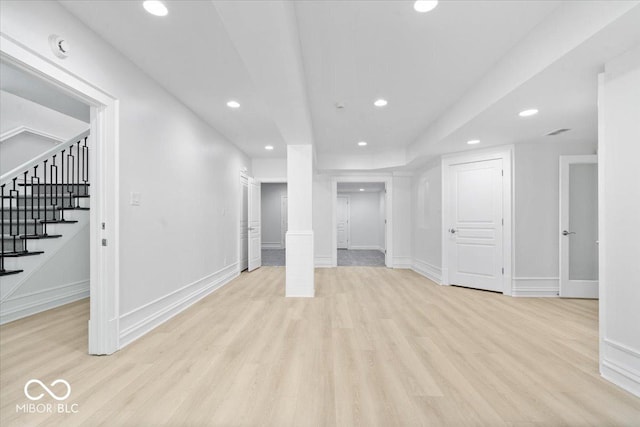 12208 Island Dr, Indianapolis, IN 46256 - below grade area featuring recessed lighting, stairway, and light wood-style floors