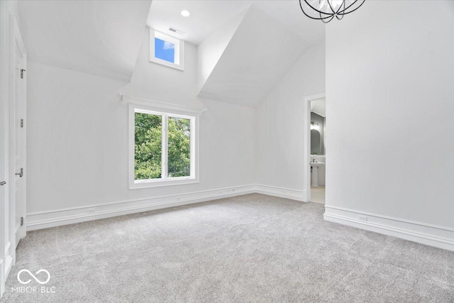 12208 Island Dr, Indianapolis, IN 46256 - empty room with vaulted ceiling and carpet floors