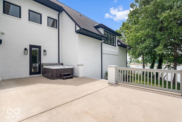 12208 Island Dr, Indianapolis, IN 46256 - view of patio featuring a hot tub