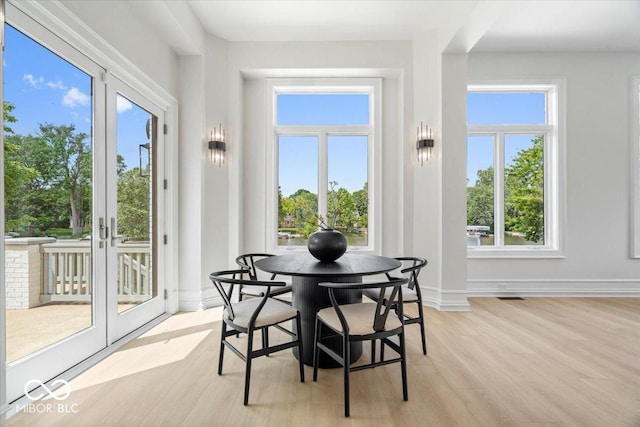 12208 Island Dr, Indianapolis, IN 46256 - dining space featuring light wood finished floors and french doors