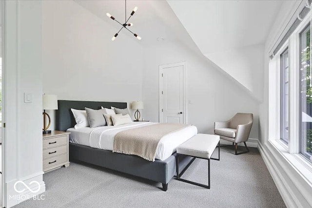 12208 Island Dr, Indianapolis, IN 46256 - bedroom with light colored carpet, vaulted ceiling, and a chandelier