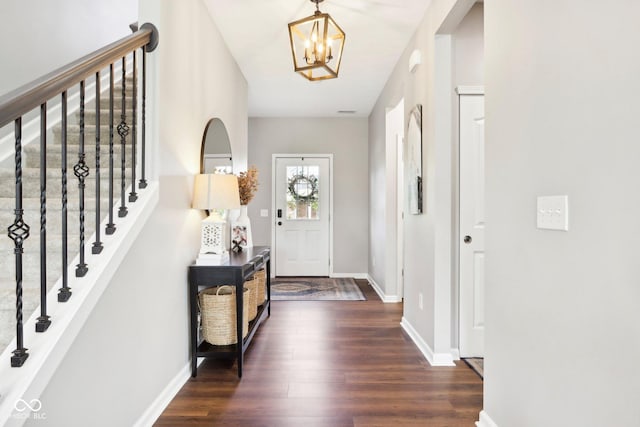 14453 Glapthorn Rd, Fishers, IN 46037 - entryway with a chandelier, dark wood finished floors, and stairway
