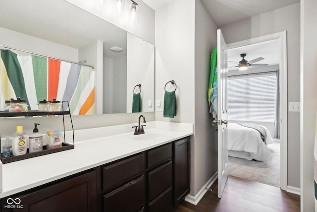 14453 Glapthorn Rd, Fishers, IN 46037 - ensuite bathroom with vanity, wood finished floors, and ceiling fan