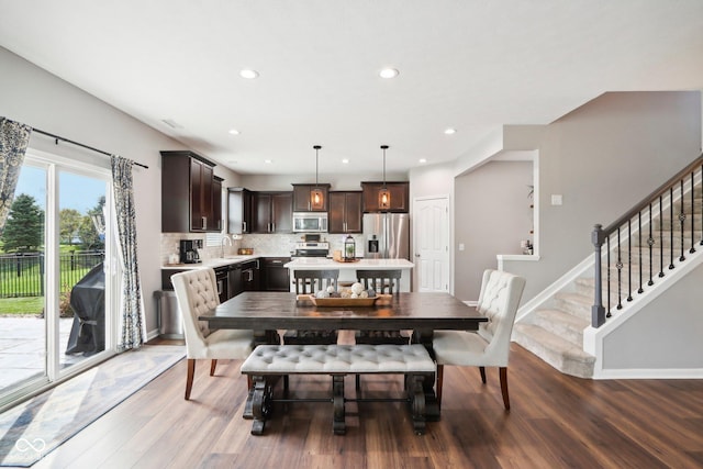 14453 Glapthorn Rd, Fishers, IN 46037 - dining space with wood finished floors, recessed lighting, and stairs
