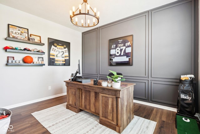 14453 Glapthorn Rd, Fishers, IN 46037 - office with a chandelier, dark wood-style flooring, and a decorative wall