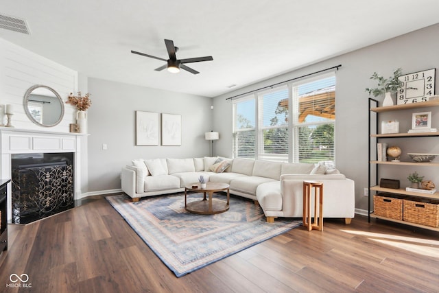 14453 Glapthorn Rd, Fishers, IN 46037 - living area featuring wood finished floors, a ceiling fan, and a fireplace