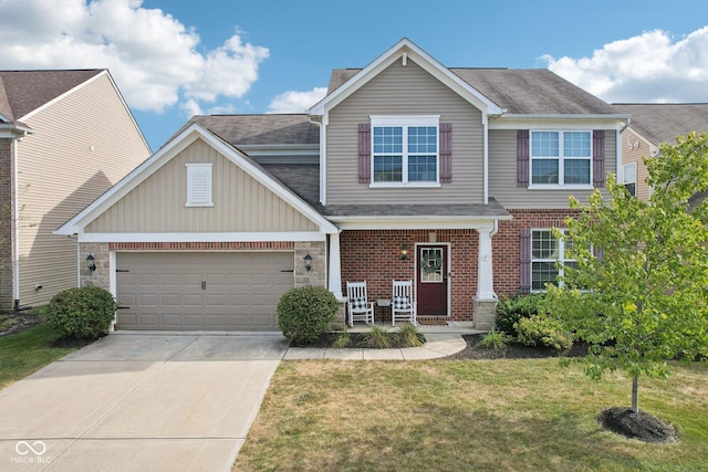 14453 Glapthorn Rd, Fishers, IN 46037 - view of front of house featuring driveway, a front yard, a garage, covered porch, and brick siding