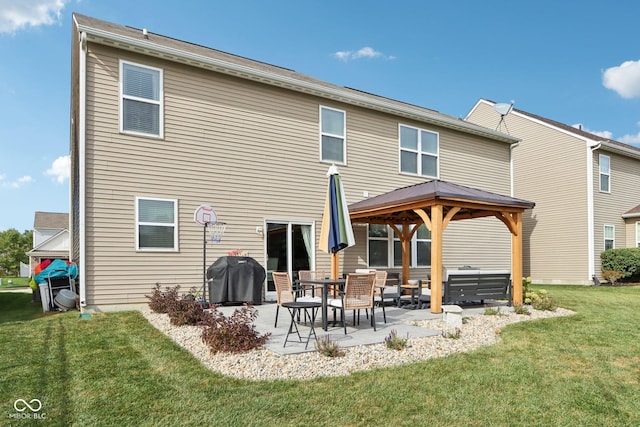 14453 Glapthorn Rd, Fishers, IN 46037 - back of property featuring a gazebo, a patio, and a lawn