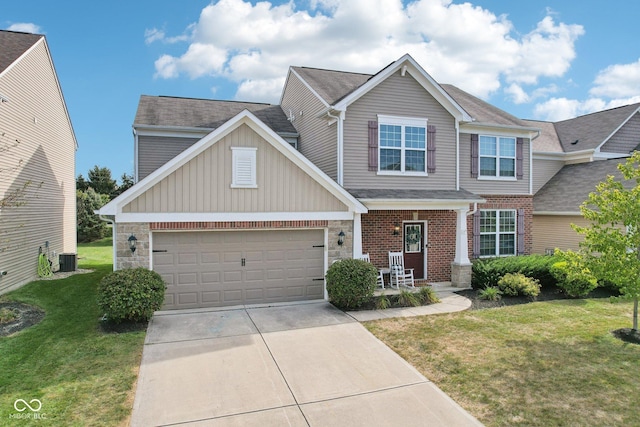 14453 Glapthorn Rd, Fishers, IN 46037 - craftsman-style house with concrete driveway, a front yard, a garage, board and batten siding, and a porch