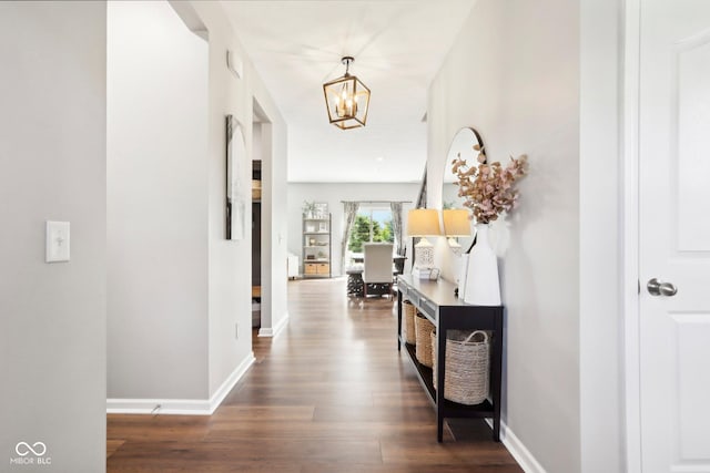 14453 Glapthorn Rd, Fishers, IN 46037 - hallway featuring a chandelier and dark wood-style flooring