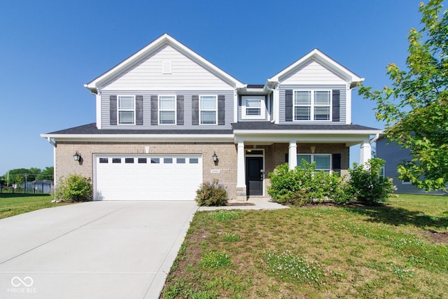 6610 Aberdeen Dr, Mccordsville, IN 46055 - view of front of property with a garage, a front yard, brick siding, and concrete driveway