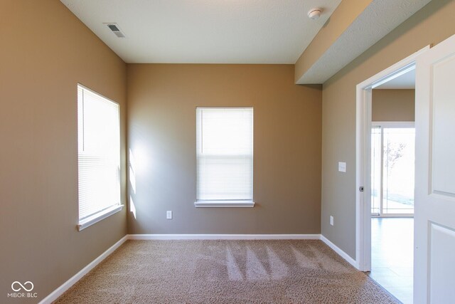 6610 Aberdeen Dr, Mccordsville, IN 46055 - carpeted empty room featuring healthy amount of natural light and a smoke detector