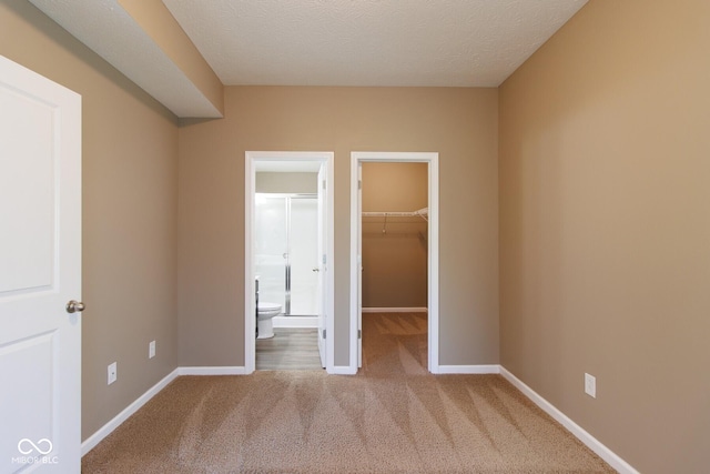 6610 Aberdeen Dr, Mccordsville, IN 46055 - unfurnished bedroom featuring a spacious closet, carpet floors, a closet, and connected bathroom