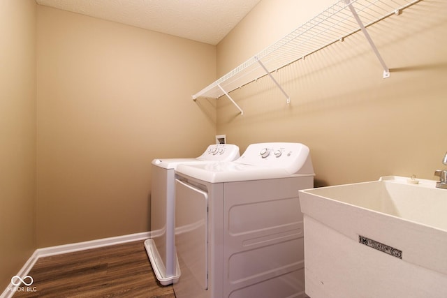 6610 Aberdeen Dr, Mccordsville, IN 46055 - laundry room featuring washing machine and clothes dryer and dark wood finished floors
