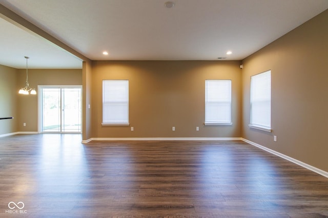 6610 Aberdeen Dr, Mccordsville, IN 46055 - empty room featuring a chandelier, dark wood-style flooring, and recessed lighting