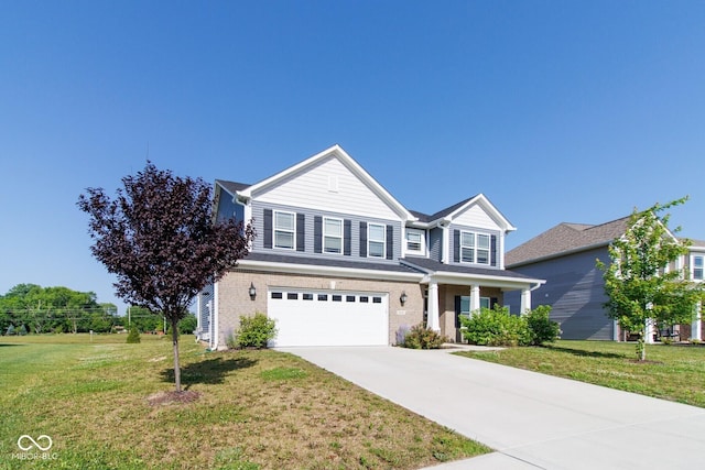 6610 Aberdeen Dr, Mccordsville, IN 46055 - traditional-style house with a garage, concrete driveway, a front lawn, and brick siding