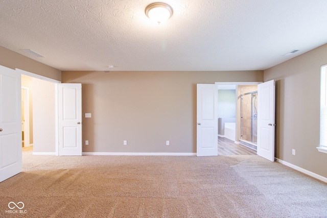 6610 Aberdeen Dr, Mccordsville, IN 46055 - unfurnished bedroom with light colored carpet and a textured ceiling