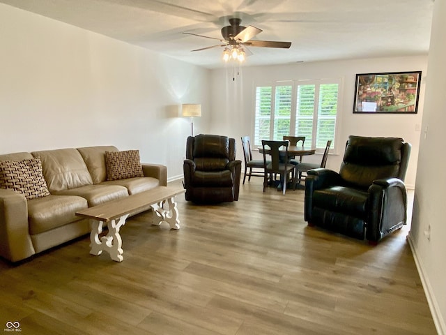 213 Drewood Dr, Trafalgar, IN 46181 - living area featuring wood finished floors and a ceiling fan