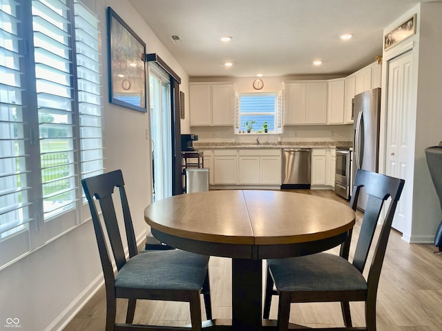 213 Drewood Dr, Trafalgar, IN 46181 - dining room featuring light wood-style floors and recessed lighting