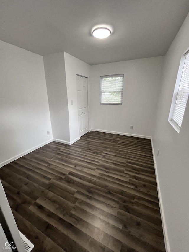 3201 W 22nd St, Indianapolis, IN 46222 - empty room featuring dark wood finished floors and baseboards