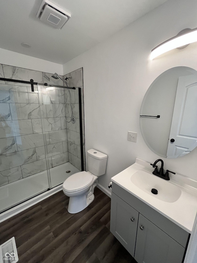 3201 W 22nd St, Indianapolis, IN 46222 - full bathroom featuring vanity, a shower stall, and wood finished floors