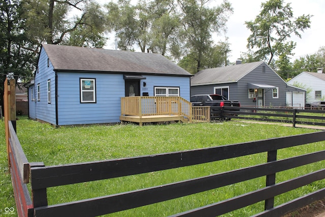 3201 W 22nd St, Indianapolis, IN 46222 - back of house with a deck, a fenced backyard, and roof with shingles