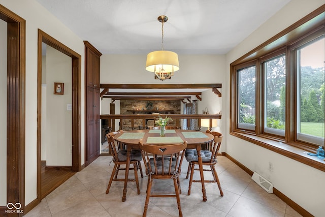 8525 Winding Ridge Rd, Indianapolis, IN 46217 - dining room featuring healthy amount of natural light and light tile patterned floors