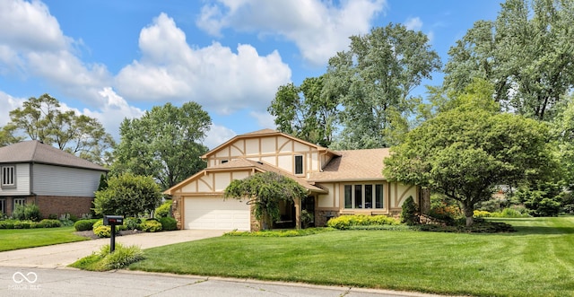 8525 Winding Ridge Rd, Indianapolis, IN 46217 - view of front facade featuring stone siding, driveway, stucco siding, a front lawn, and a garage