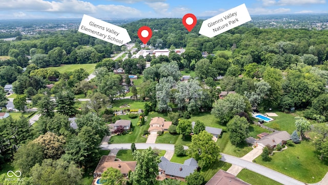 8525 Winding Ridge Rd, Indianapolis, IN 46217 - aerial overview of property's location featuring a heavily wooded area and nearby suburban area