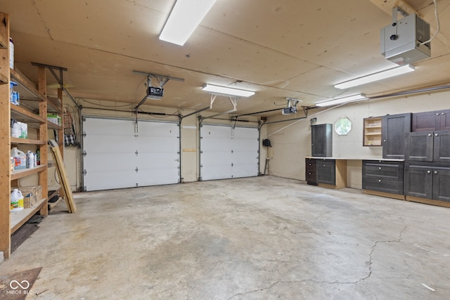 396 W 500 S, Anderson, IN 46013 - garage with a garage door opener and a heating unit