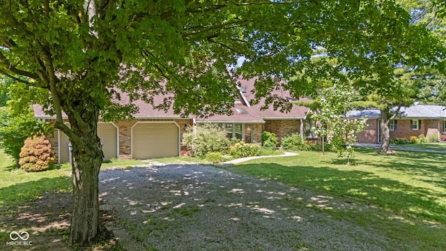 396 W 500 S, Anderson, IN 46013 - view of front of home with brick siding, a front yard, and driveway