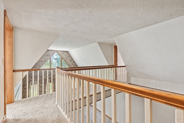 396 W 500 S, Anderson, IN 46013 - hallway featuring a textured ceiling, vaulted ceiling, and carpet flooring
