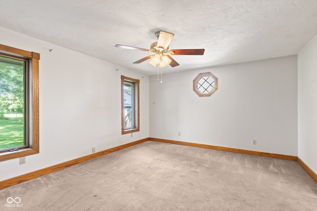 396 W 500 S, Anderson, IN 46013 - unfurnished room featuring healthy amount of natural light, light carpet, ceiling fan, and a textured ceiling