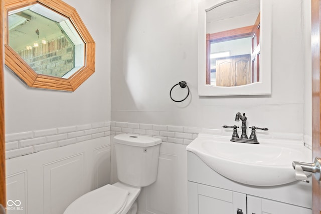 396 W 500 S, Anderson, IN 46013 - half bathroom with tile walls, vanity, and wainscoting