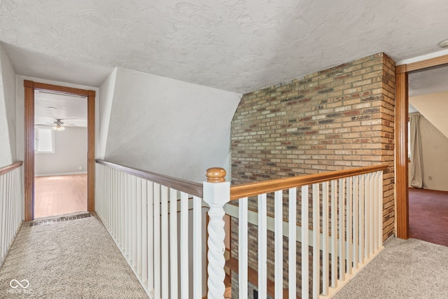 396 W 500 S, Anderson, IN 46013 - hall featuring carpet floors, a textured ceiling, and an upstairs landing