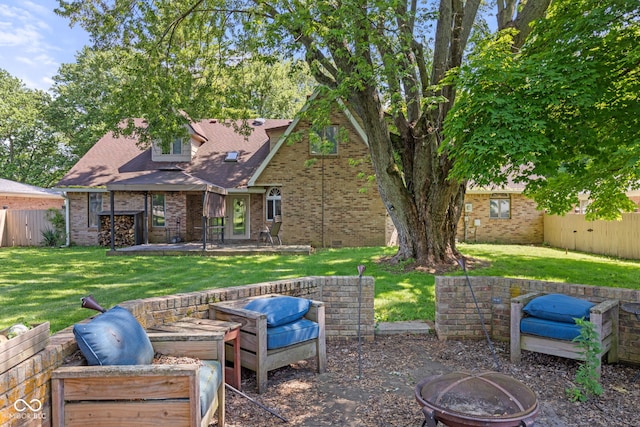 396 W 500 S, Anderson, IN 46013 - rear view of house with a fire pit, a patio, brick siding, and a shingled roof