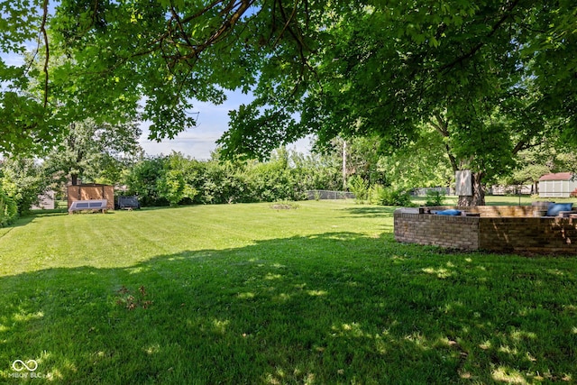 396 W 500 S, Anderson, IN 46013 - view of green lawn featuring a storage unit and view of wooded area