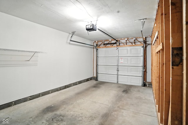 5003 Opal Ridge Ln Unit 101, Indianapolis, IN 46237 - garage with a garage door opener and baseboards