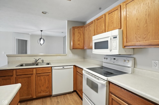 5003 Opal Ridge Ln Unit 101, Indianapolis, IN 46237 - kitchen featuring white appliances, light wood-style flooring, and light countertops