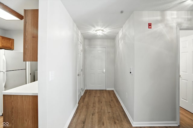 5003 Opal Ridge Ln Unit 101, Indianapolis, IN 46237 - hallway with wood finished floors and baseboards