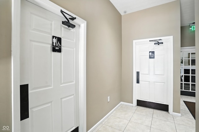 5003 Opal Ridge Ln Unit 101, Indianapolis, IN 46237 - foyer featuring light tile patterned floors and baseboards