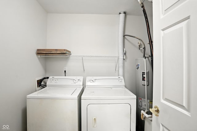 5003 Opal Ridge Ln Unit 101, Indianapolis, IN 46237 - washroom featuring electric water heater and separate washer and dryer