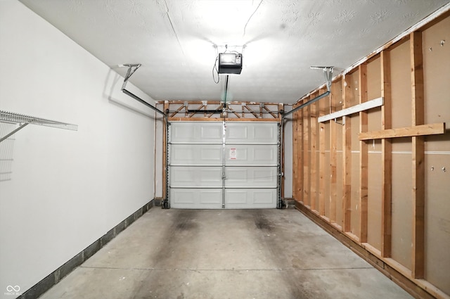 5003 Opal Ridge Ln Unit 101, Indianapolis, IN 46237 - garage with a garage door opener and baseboards